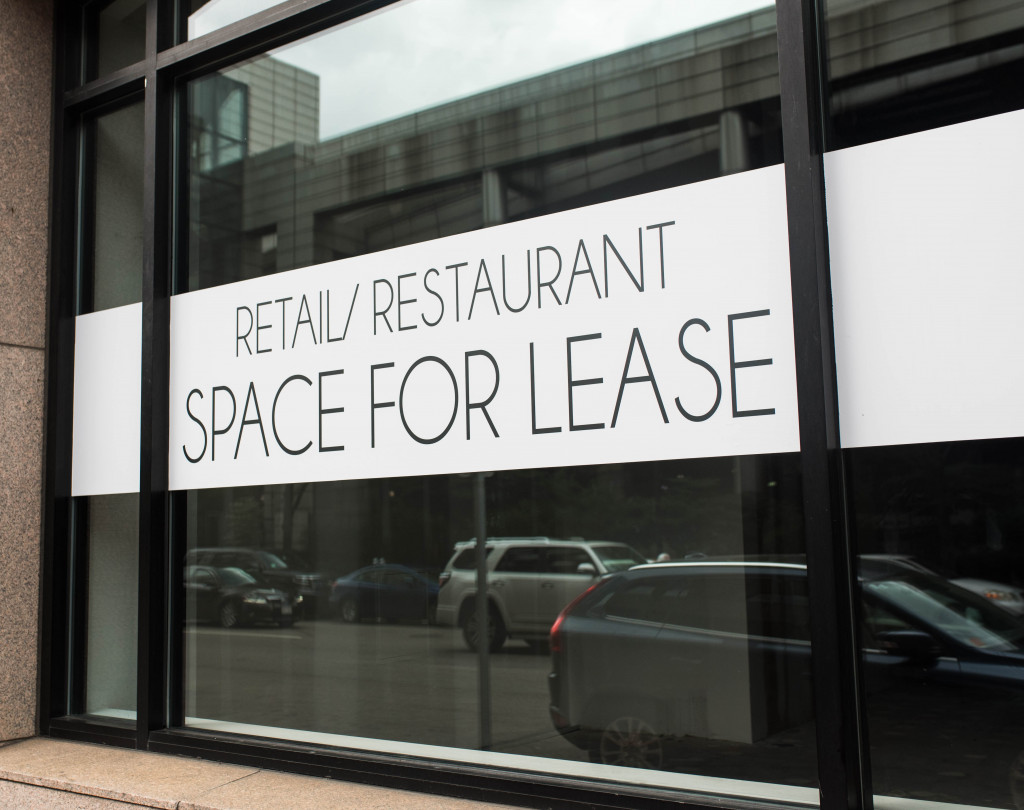 Signage saying that the restaurant space is for lease