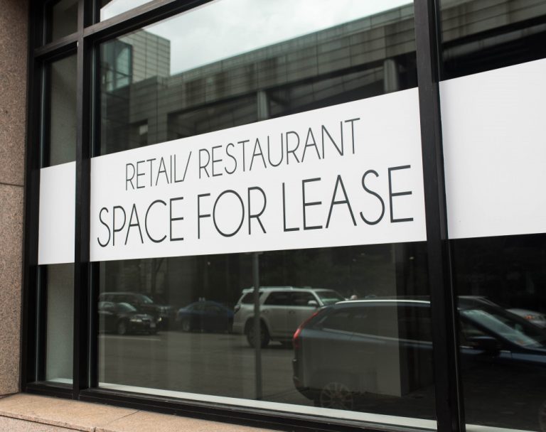 Retail space for rent sign outside a commercial space.
