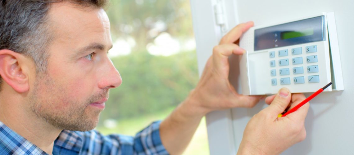 a person installing a home security